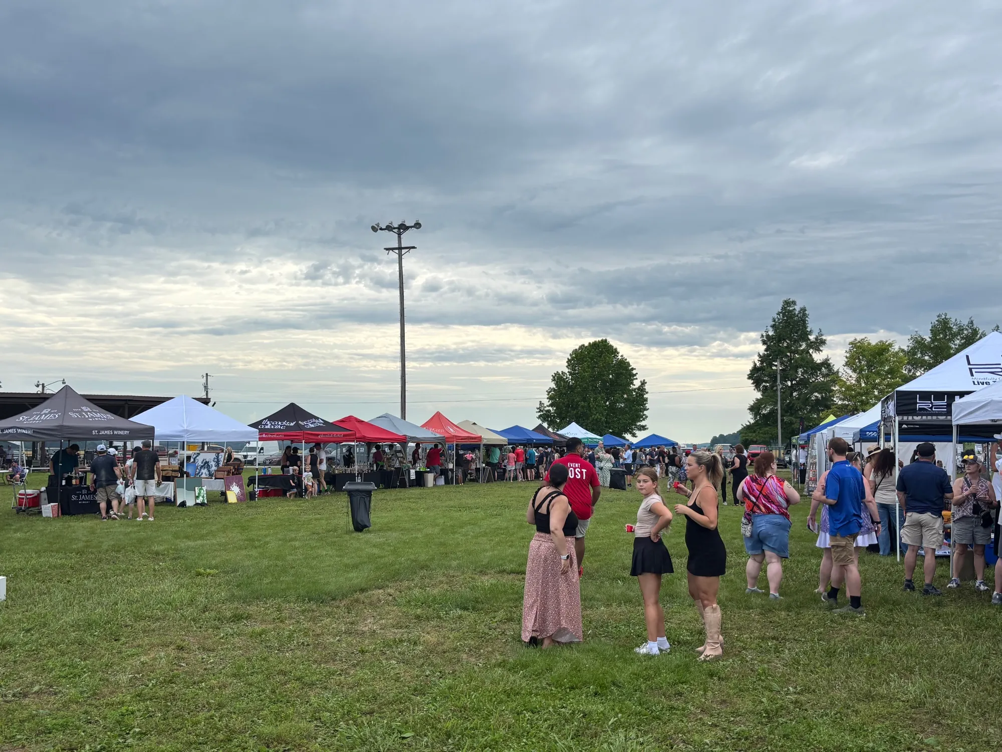 Guests exploring rows of vendor tents at the 1st Annual MO Spirit Festival